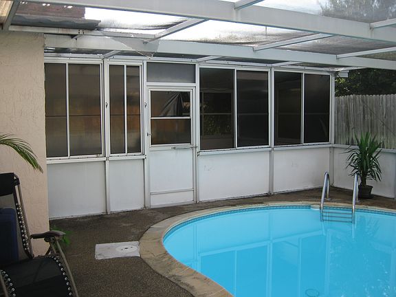 deep end of pool and sunroom