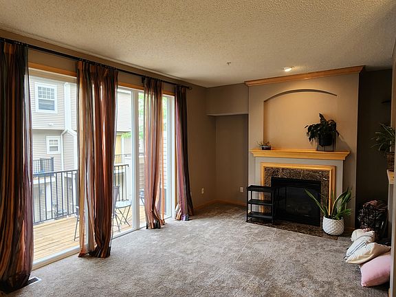 Living room with tall sliding glass door to the deck.