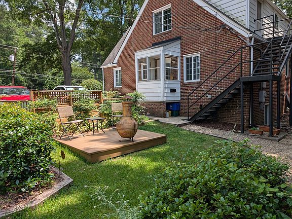 Small courtyard with deck. Stairs lead to your private entrance; basement entry is below stairs.