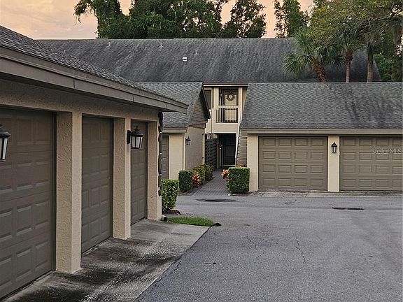 The one car garage and drive area leading to the garage