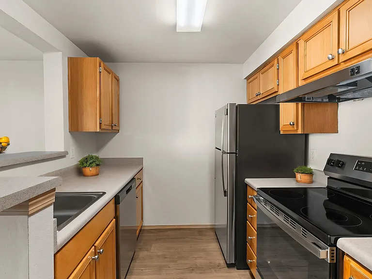 A welcoming kitchen with modern appliances and plenty of space to cook and gather. A welcoming kitchen with modern appliances and plenty of space to cook and gather.