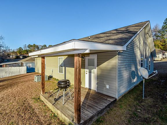 Image 5: Back of home with a grilling porch