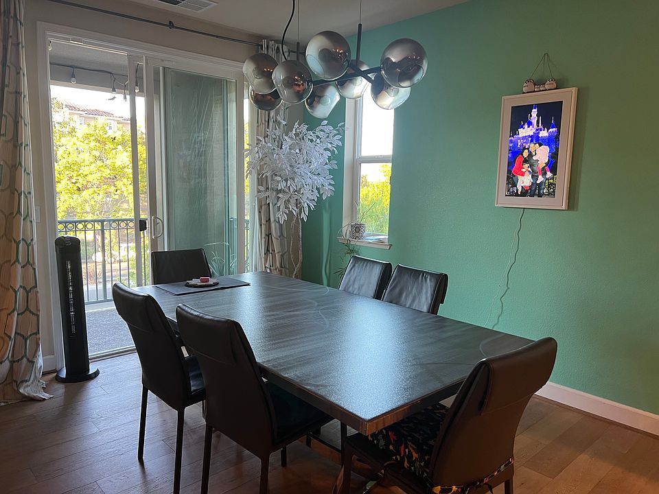 Dining area with entrance to large balcony