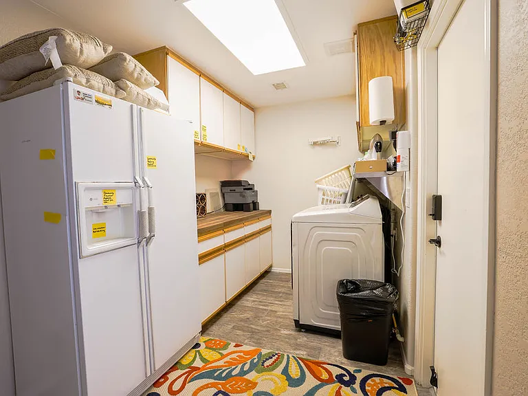 Laundry room with washer/dryer/laundry supplies