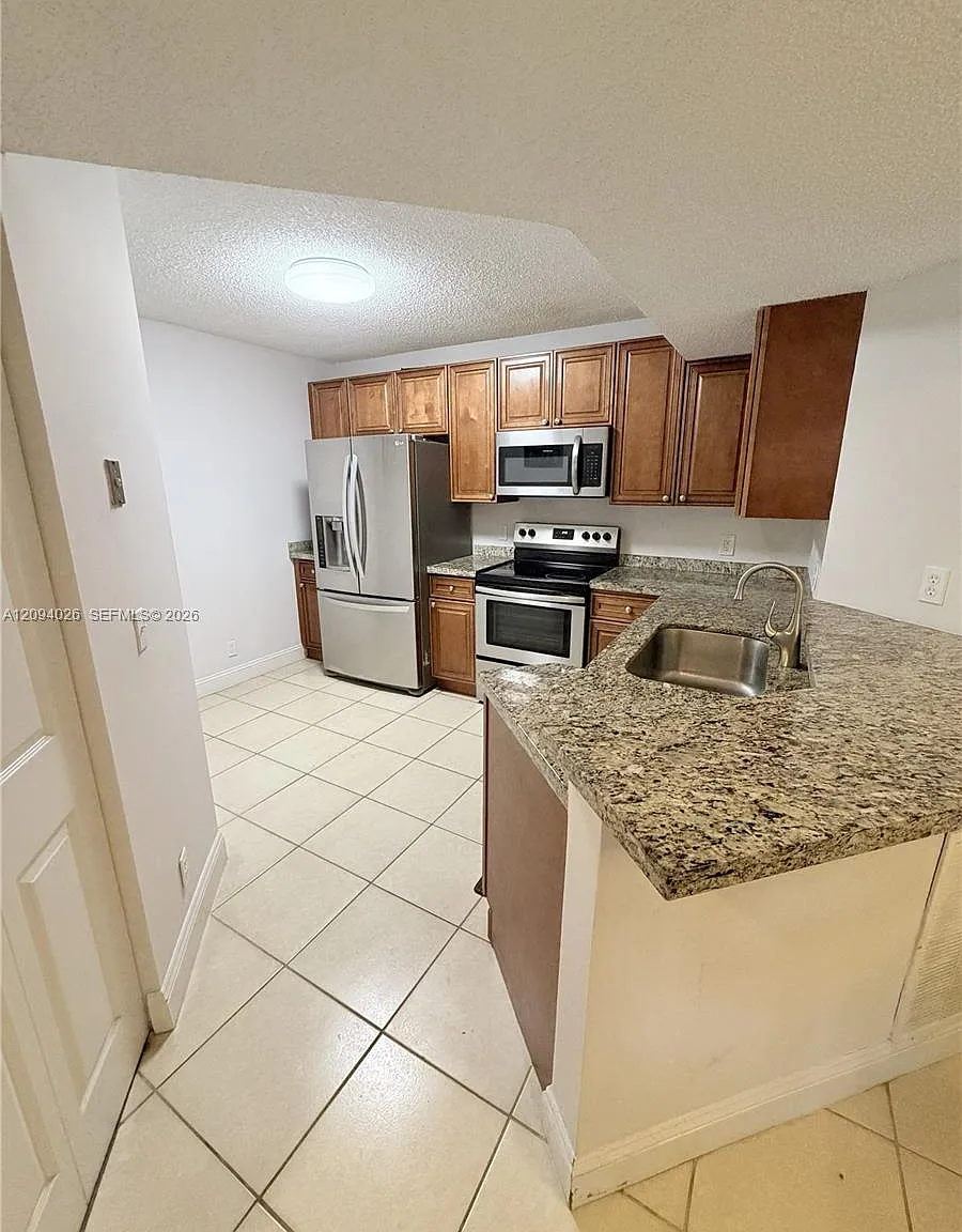 8741 Wiles Rd — Photo 2