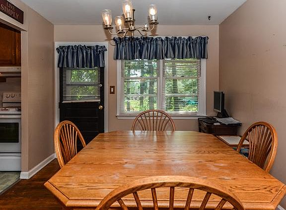 Dining rm is open to kitchen & has door to yard