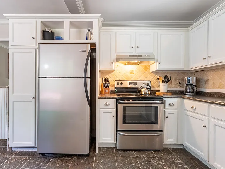 Please note, kitchen refrigerator, stove, and hood have been upgraded since this photo.