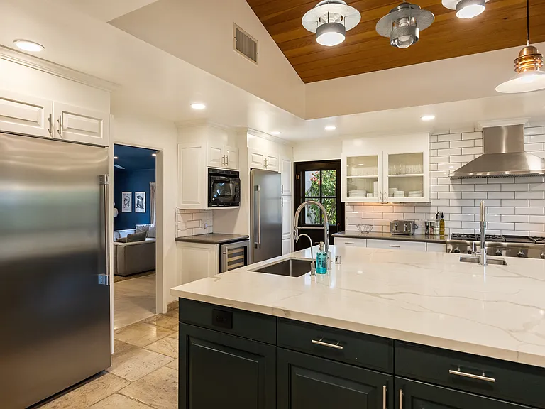 Large fridge and freezer combo with optional grocery delivery and pre-stocking services available.