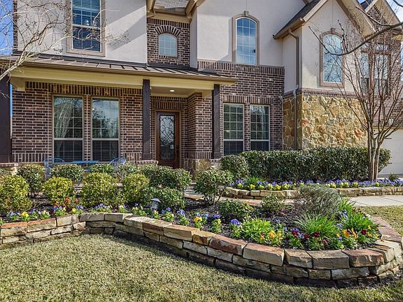 Gorgeous landscaping surround this beautiful property.