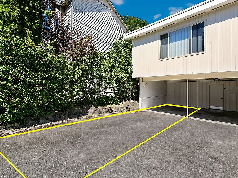 Carport and additional uncovered parking space.