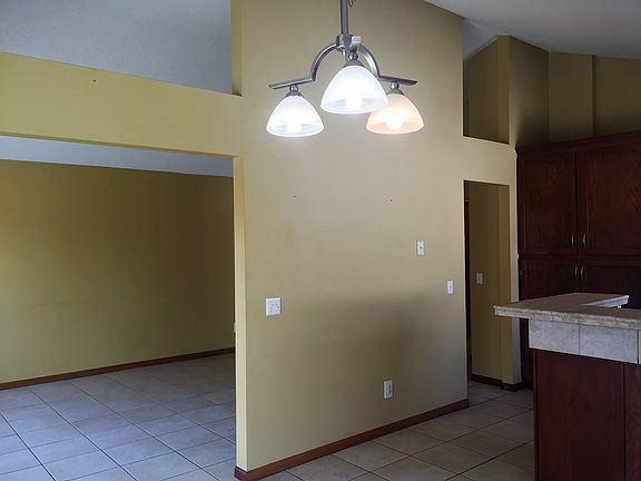 Vaulted ceilings and openings between living and kitchen are