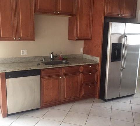 Large kitchen with stainless appliances 
