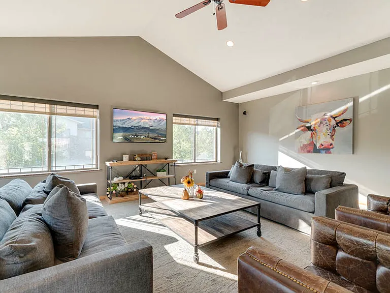 Spacious clubhouse lounge with cozy seating for gatherings and relaxation.