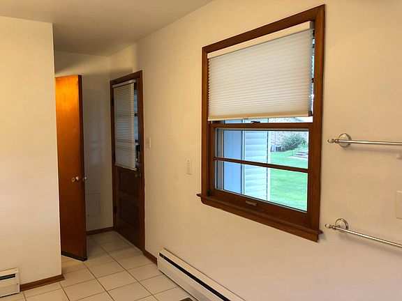 Kitchen, window and door on carport side, and basement door.