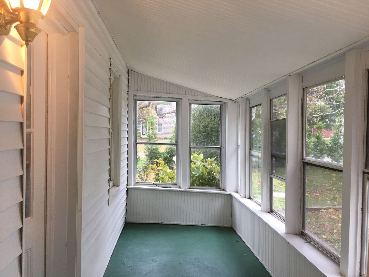  Rear enclosed  Porch that leads to the Parking lot