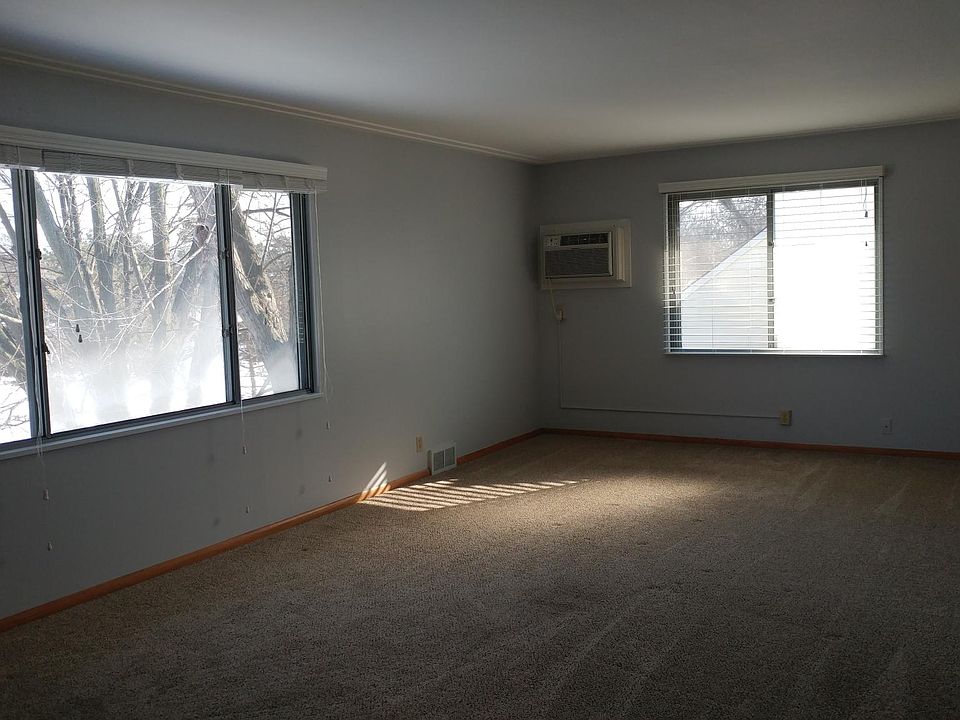 Large living room with view of park.