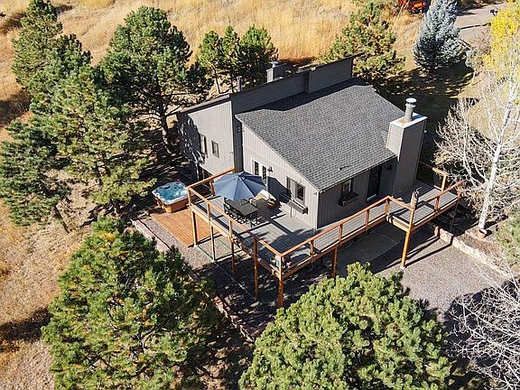 Sun-lit deck for indoor/outdoor living. Private hot tub with views.