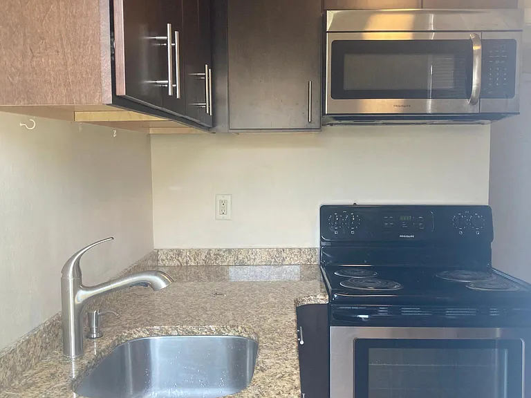 Kitchen with granite counters and stainless steel appliances