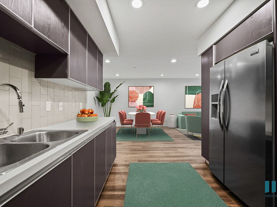 Kitchen with Stainless-Steel Appliances and Dining Room