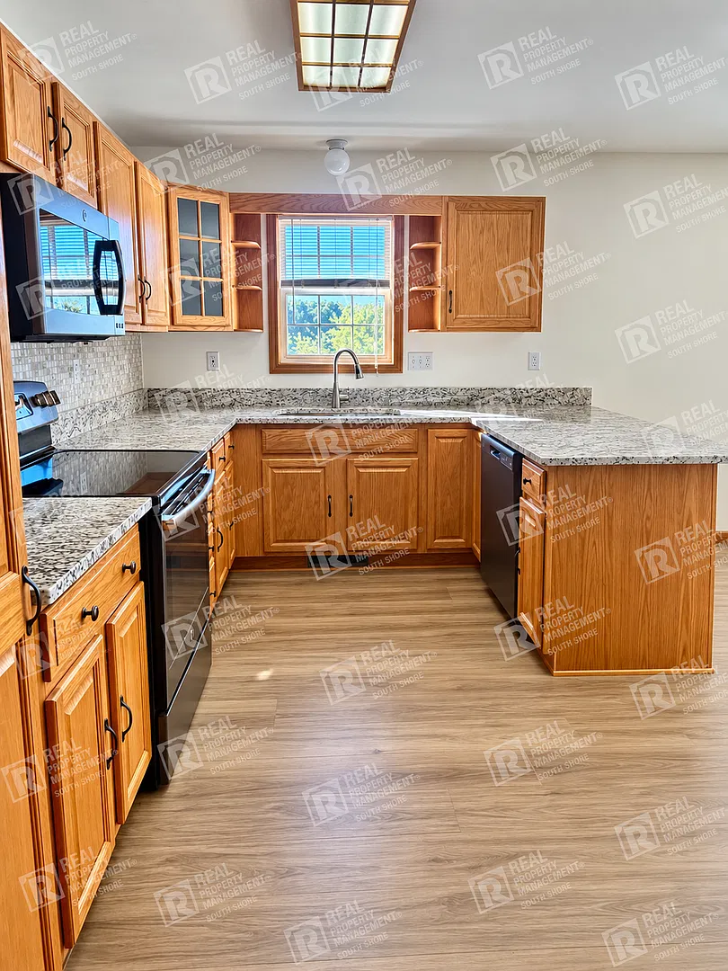 4-Bed/2-Bath Home with Soaring Ceilings, Luxury Kitchen, & Outdoor Living — Photo 3