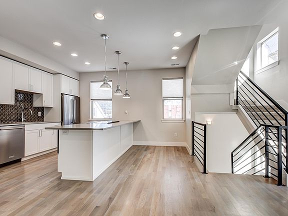 Kitchen, facing balcony and open to living area