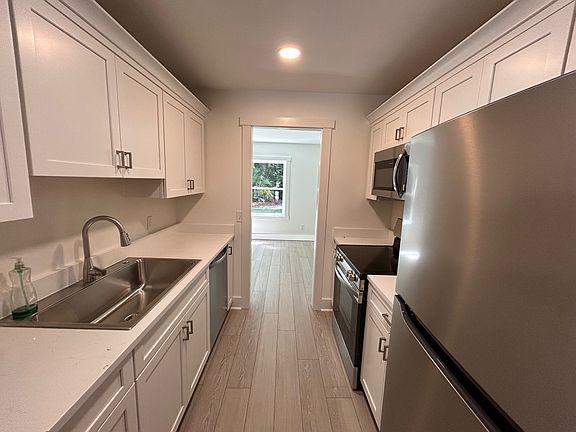 Kitchen between livingroom and dining/additional sitting area