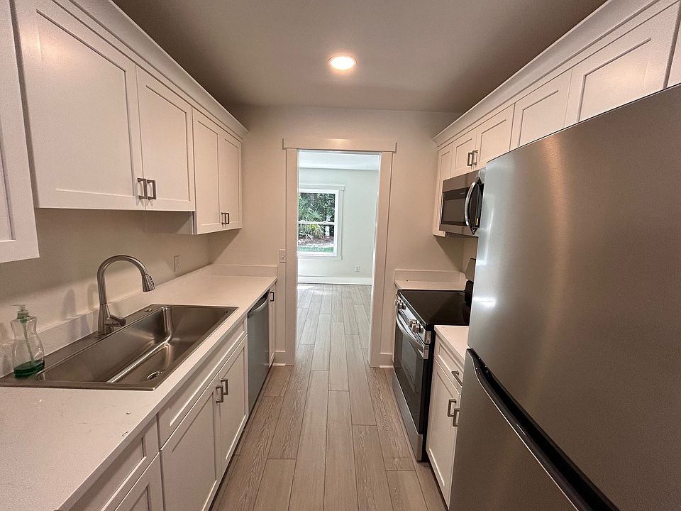 Kitchen between livingroom and dining/additional sitting area