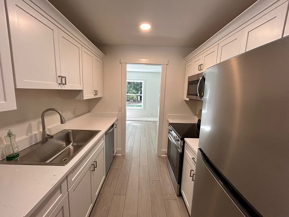 Kitchen between livingroom and dining/additional sitting area