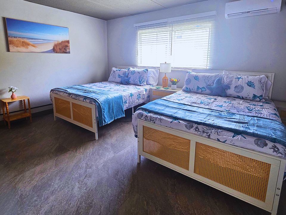 Light-filled room with artwork and air conditioning