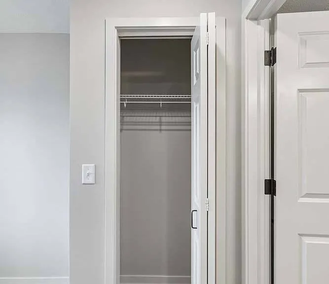 A thoughtfully designed walk-in closet provides ample storage to keep your space organized and clutter-free.