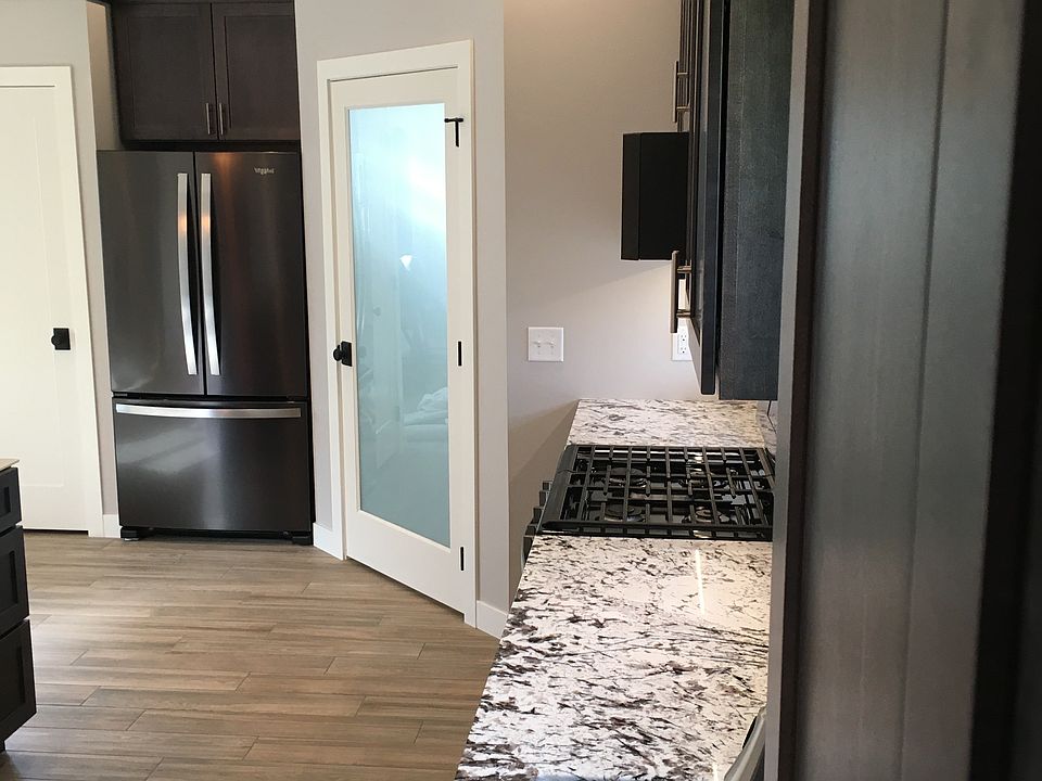 walk-in pantry, built in fridge and cleaning closet