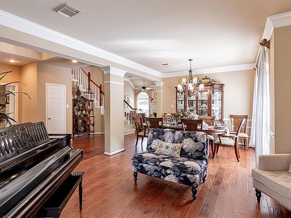 Enter into the Formal Living Room, which provides a nice place for your piano and enjoy visiting with family & friends or enjoy a good book.