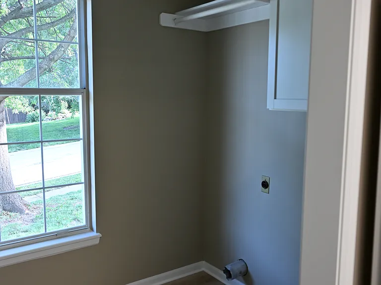 View of laundry room from kitchen. Washer/dryer hookups.