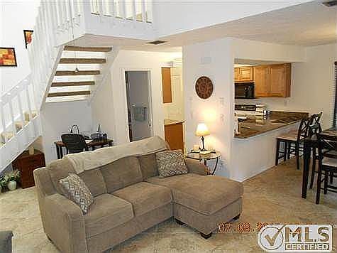 Another view of the living area with computer area behind so