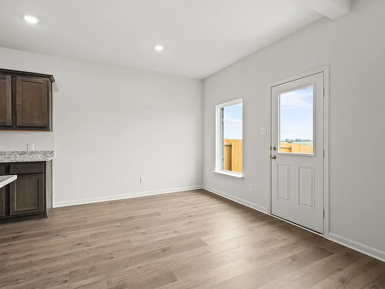 The dining room has a large window that lets in great, natural light.
