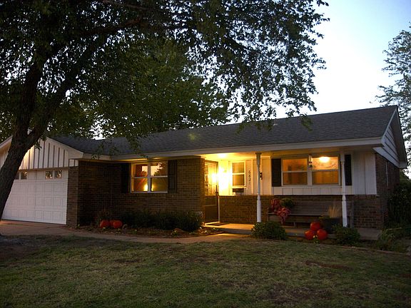 Featuring a two car garage with built-in cabinetry for added organization and 