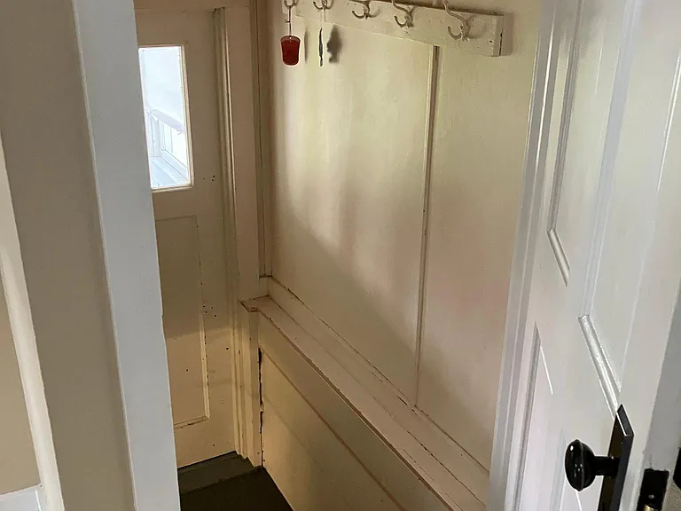 Entrance from mudroom area/basement stairs into kitchen