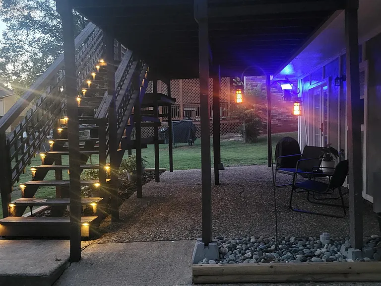 LARGE covered patio with seating and grill