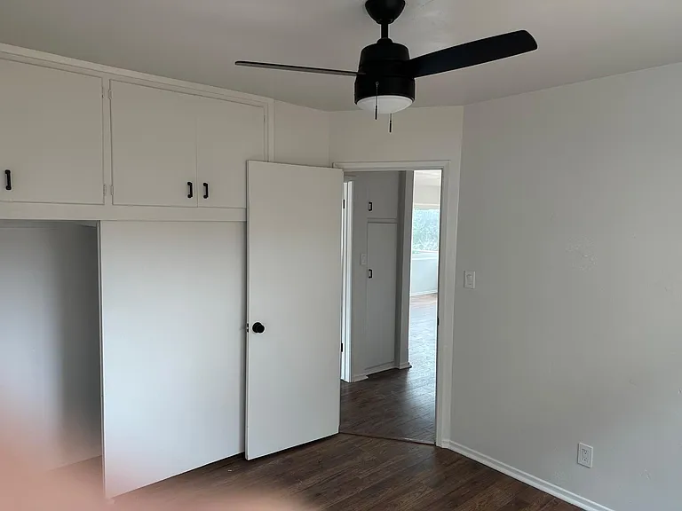 Bedroom Entrance with view of built in closet and storage