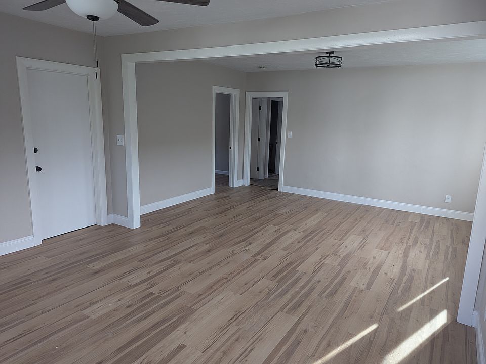 Living Room / Dining Room Combination and Front Entrance Door from Street. Includes ceiling fan.