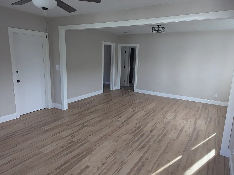 Living Room / Dining Room Combination and Front Entrance Door from Street. Includes ceiling fan.