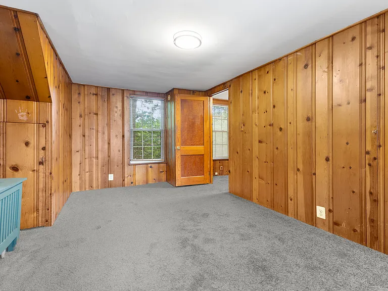 Cozy, wood-paneled room