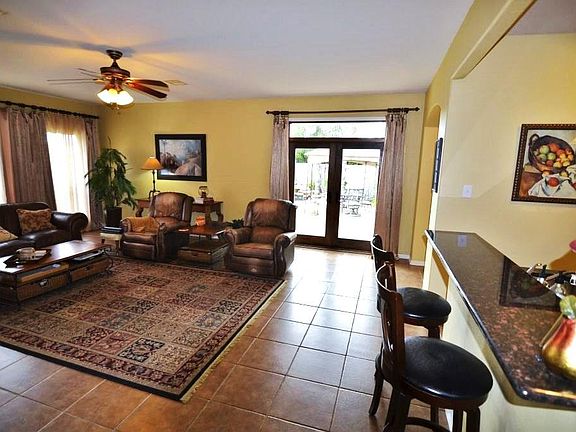 View from the den area to the outside pool paradise....notice the double insulated doors which leads