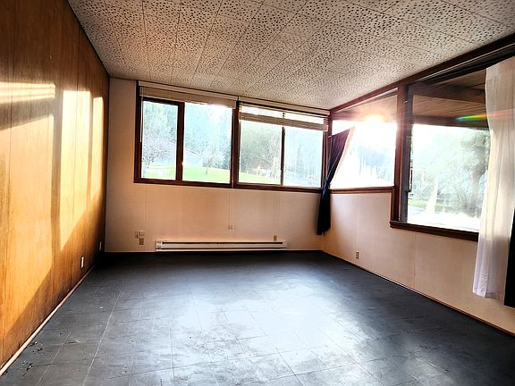 Living room with a grand wall of windows.
