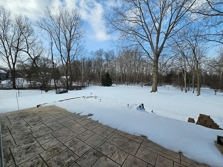 Stamped concrete patio and private backyard