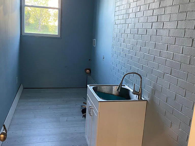 Large Laundry room with utility sink