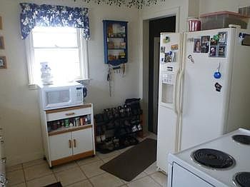 Efficient Kitchen with ceramic flooring.