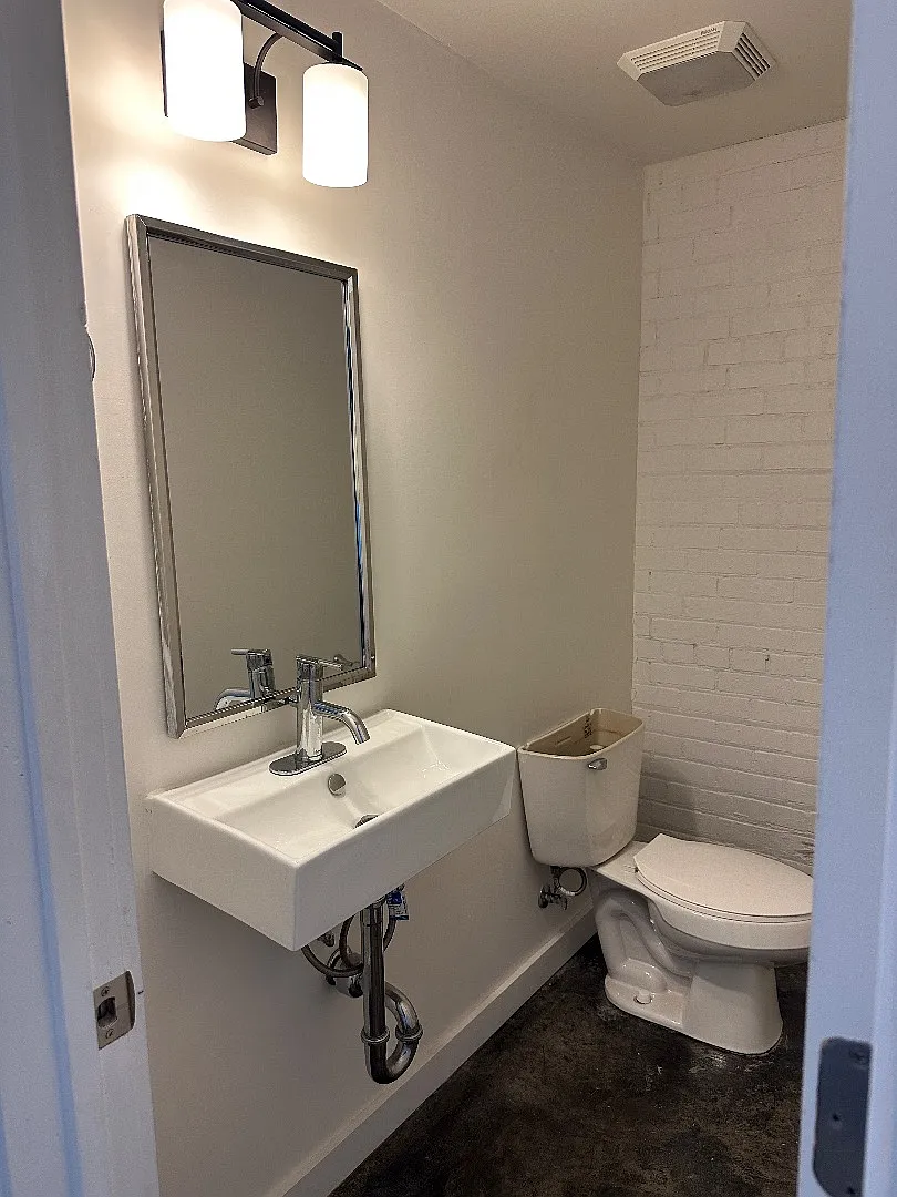 Industrial-Chic 2BR/2.5BA with Rooftop Views + Off-Street Parking in Historic Algiers Point — Photo 1