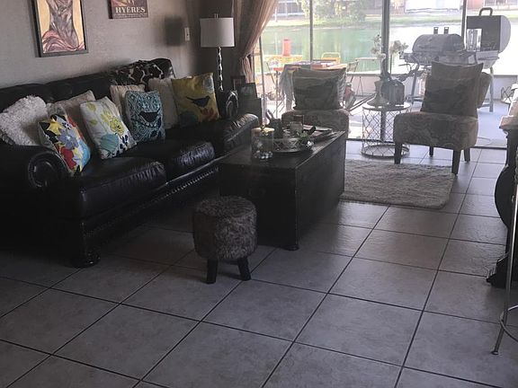Spacious living room leads out to the screen patio