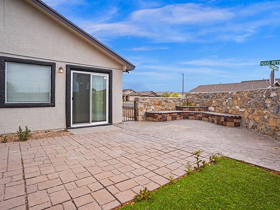 Backyard and double glassdoor leading from interior to backyard